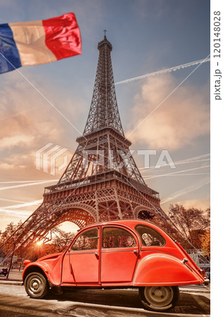Paris with two symbols the Eiffel Tower and old red car in France 120148028