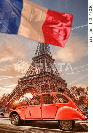 Paris with two symbols the Eiffel Tower and old red car in France 120148030