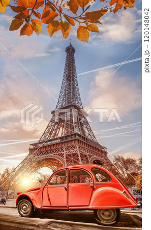 Paris with two symbols the Eiffel Tower and old red car in France 120148042