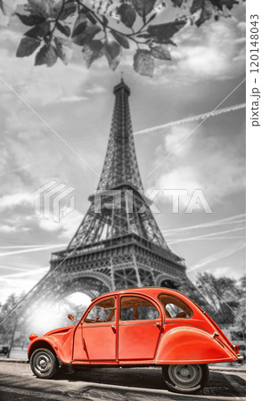 Paris with two symbols the Eiffel Tower and old red car in France 120148043