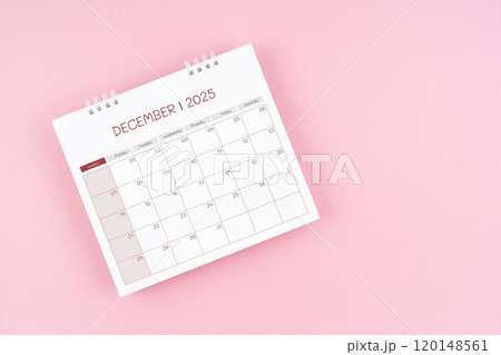 Top view on December desk calendar for 2025 year on pink background. 120148561