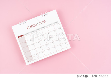 Top view on March desk calendar for 2025 year on pink background. Top view on March desk calendar for 2025 year on pink background. 120148567