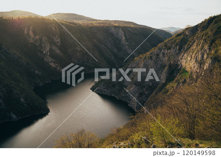 The iconic Ferris wheel amidst the picturesque landscapes during sunset The iconic Ferris wheel amidst the picturesque landscapes during sunset 120149598