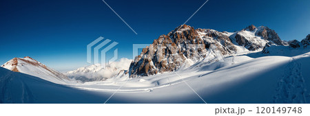 Scenic panoramic view of breathtaking high-altitude mountains in Central Asia. Experience winter expedition through the majestic Tien Shan range, Almaty Mountains of Kazakhstan national natural park. 120149748