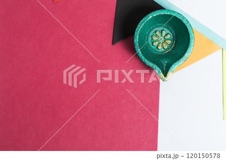 Blank Colored Paper Note with Festive Diya and Decorative Flag on White Background. Diwali Celebration. Place for text. Blank Colored Paper Note with Festive Diya and Decorative Flag on White Background. Diwali Celebration. Place for text. 120150578
