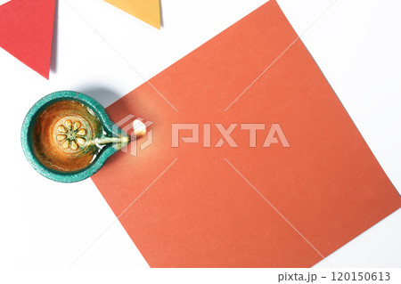 Top View of Colorful Diwali Oil Lamp with Vibrant Papers for Festive Celebration 120150613