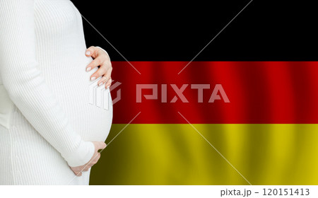 German pregnant woman belly against German flag background. Demographics and pregnancy German pregnant woman belly against German flag background. Demographics and pregnancy 120151413