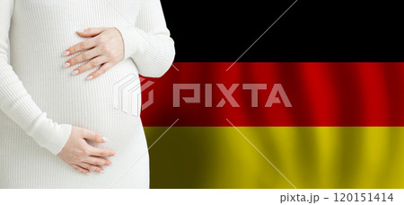 Pregnant woman belly against German flag background. Demographics and pregnancy in Germany concept 120151414