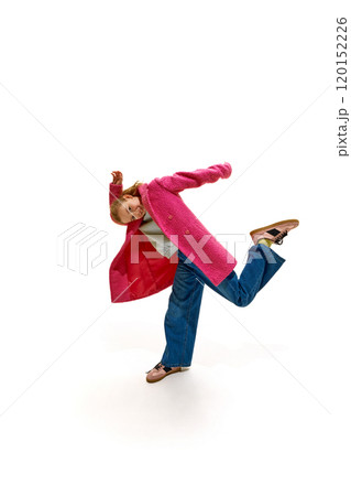 Stylish little girl posing raising hands and leg against white studio background. Stylish little girl posing raising hands and leg against white studio background. 120152226