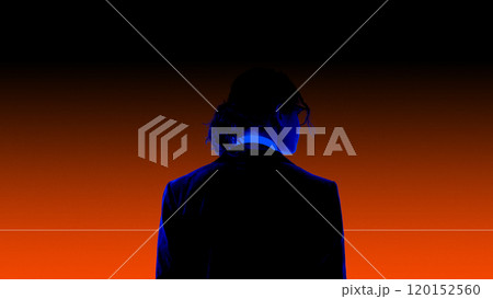 Silhouette of young man in suit, illuminated by dramatic blue and red gradient background. Abstract, conceptual, and artistic designs Silhouette of young man in suit, illuminated by dramatic blue and red gradient background. Abstract, conceptual, and artistic designs 120152560