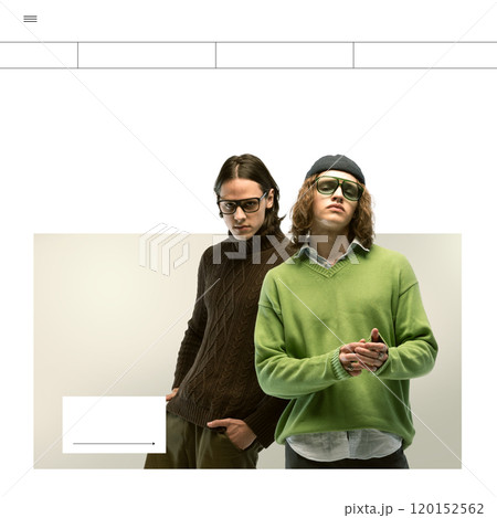 Two young men, one in green sweater and one in brown turtleneck, posing side by side on minimalist background. Lifestyle branding, fashion, and youth culture 120152562