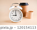 Minimalist Composition with Alarm Clock and EcoFriendly Coffee Cups Time and Sustainability 120154113