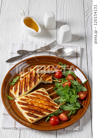 Grilled Greek Halloumi Cheese on sticks, top view 120154131