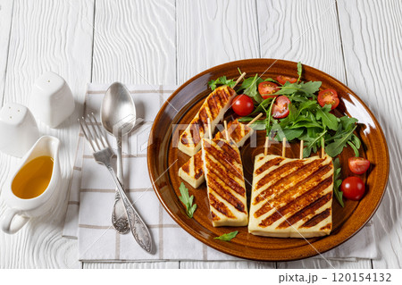 Grilled Greek Halloumi Cheese on sticks, top view Grilled Greek Halloumi Cheese on sticks, top view 120154132