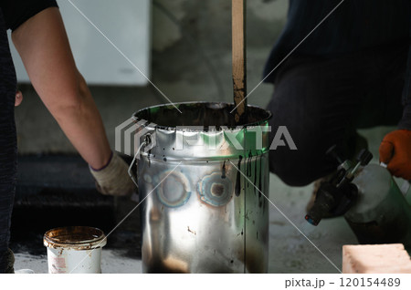 A large bucket of resin for waterproofing the floor in the house. 120154489
