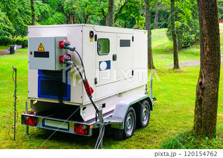 Connected large rental diesel generator on a mobile trailer for outdoor event power supply Connected large rental diesel generator on a mobile trailer for outdoor event power supply 120154762