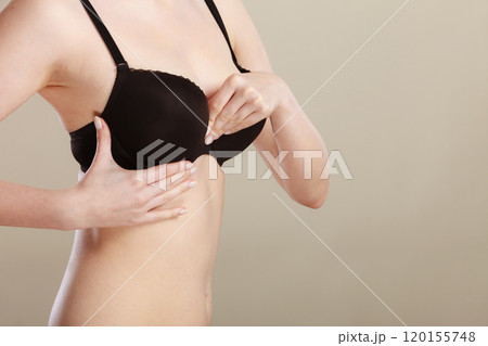 Girl getting comfortable in her bra Girl getting comfortable in her bra 120155748