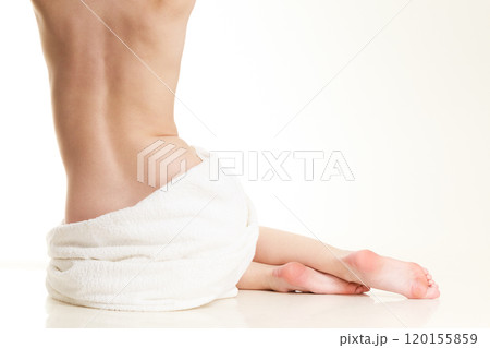 Sitting naked woman in white towel Sitting naked woman in white towel 120155859
