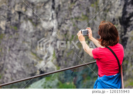 Tourist woman on Trollstigen viewpoint in Norway 120155943
