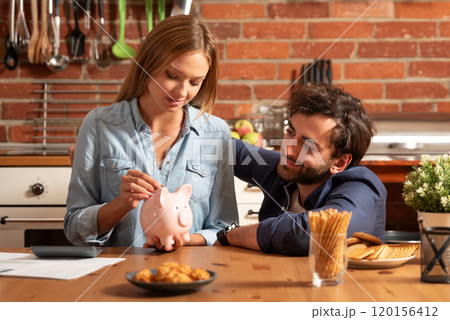 Couple savings concept with piggy bank 120156412