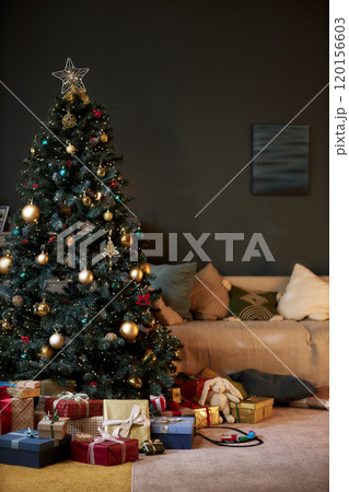 Vertical background image of festive home interior with Christmas tree and presents, copy space Vertical background image of festive home interior with Christmas tree and presents, copy space 120156603