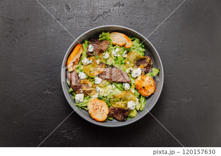 Gourmet salad with blue cheese, pear slices, toasted bread, and greens, perfect fusion of flavors Gourmet salad with blue cheese, pear slices, toasted bread, and greens, perfect fusion of flavors 120157630