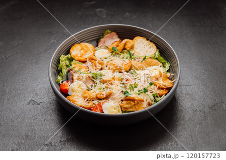 Fresh Caesar salad with grilled chicken, cheese, croutons, and boiled egg Fresh Caesar salad with grilled chicken, cheese, croutons, and boiled egg 120157723