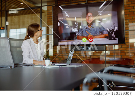 Video conferences in modern offices enhance collaboration and productivity among teams Video conferences in modern offices enhance collaboration and productivity among teams 120159307