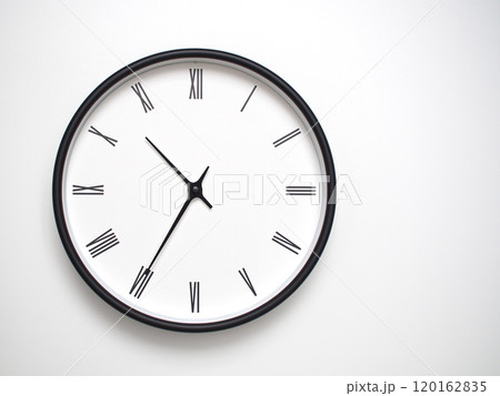 Clock Showing 10.35 or 22.35 with Roman Numerals. Simple Round Clock for Concepts of Time Management and Scheduling. Clock Showing 10.35 or 22.35 with Roman Numerals. Simple Round Clock for Concepts of Time Management and Scheduling. 120162835