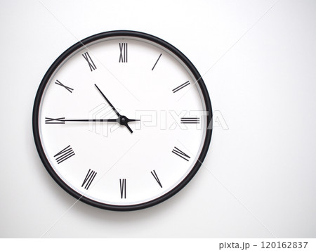 Clock Showing 22.45 or 10.45 with Roman Numerals. Simple Round Clock for Concepts of Time Management and Scheduling. 120162837