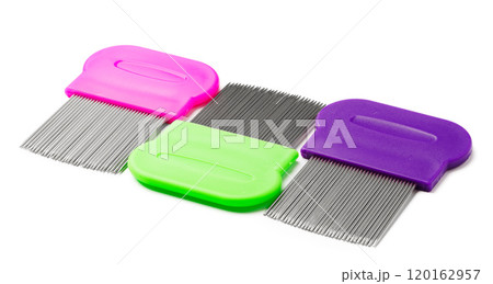 Colorful plastic and metal combs on a white background Colorful plastic and metal combs on a white background 120162957