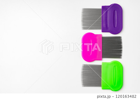 Colorful plastic and metal combs on a white background 120163482