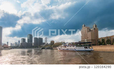 Cruise ship sails on the Moscow river in Moscow city center, popular place for walking. 120164290