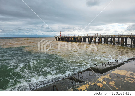 Old pier on the embankment. Black Sea, Alushta. Old pier on the embankment. Black Sea, Alushta. 120166416