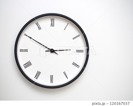 Clock Showing 14.50 or 02.50 with Roman Numerals. Simple Round Clock for Concepts of Time Management and Scheduling. 120167037