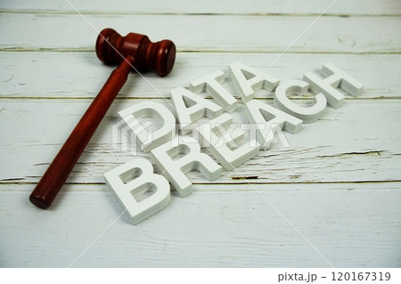 Data Breach alphabet letters and magnifying glass top view on wooden background Data Breach alphabet letters and magnifying glass top view on wooden background 120167319