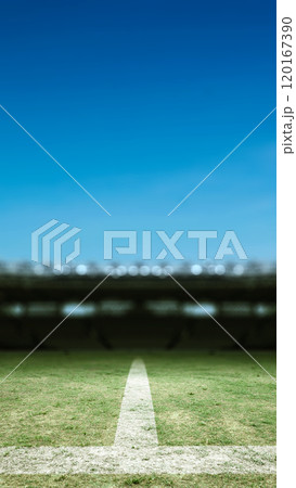 Empty football stadium with green field and blur spotlights. The field is ready for a game 120167390