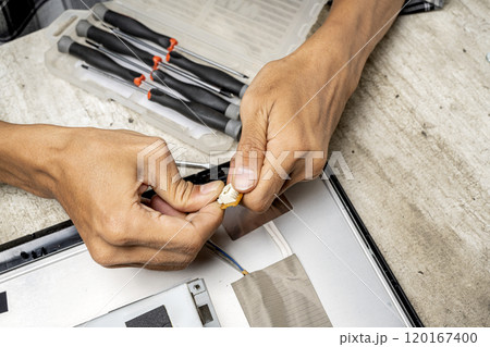 Man technician plug the television socket 120167400