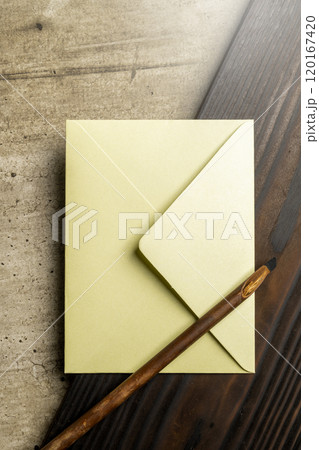 Calligraphy reeds with envelope on the table 120167420