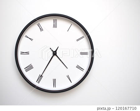 Clock Showing 16.35 or 04.35 with Roman Numerals. Simple Round Clock for Concepts of Time Management and Scheduling. Clock Showing 16.35 or 04.35 with Roman Numerals. Simple Round Clock for Concepts of Time Management and Scheduling. 120167710