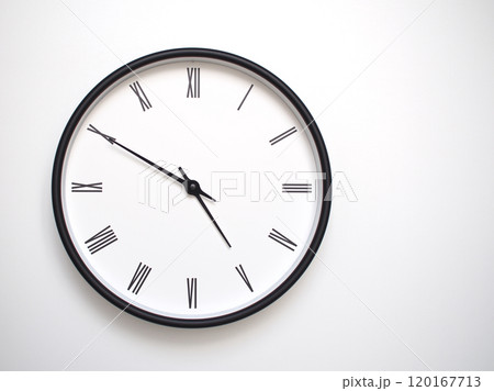 Clock Showing 16.50 or 04.50 with Roman Numerals. Simple Round Clock for Concepts of Time Management and Scheduling. 120167713