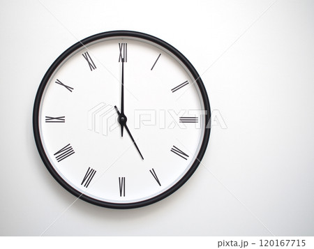 Clock Showing 17.00 or 05.00 with Roman Numerals. Simple Round Clock for Concepts of Time Management and Scheduling. 120167715