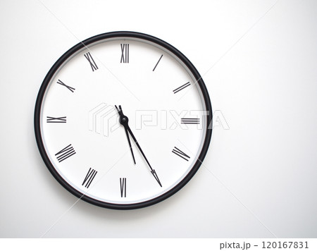 Clock Showing 17.25 or 05.25 with Roman Numerals. Simple Round Clock for Concepts of Time Management and Scheduling. Clock Showing 17.25 or 05.25 with Roman Numerals. Simple Round Clock for Concepts of Time Management and Scheduling. 120167831