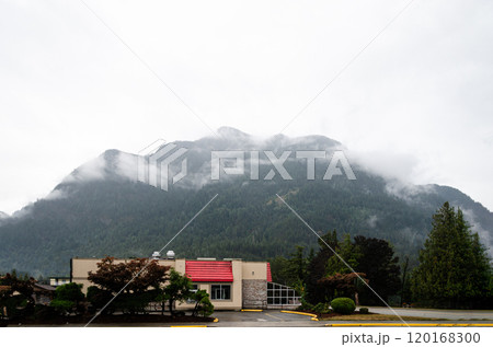 Cloud covered green mountains 120168300