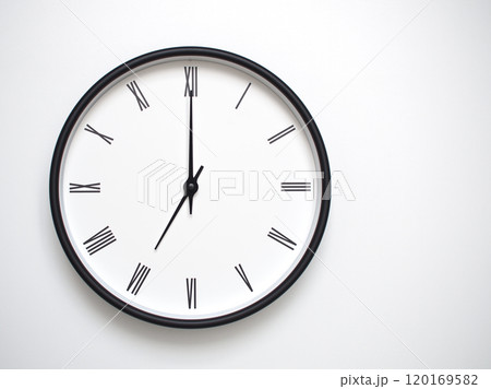 Clock Showing 19.00 or 07.00 with Roman Numerals. Simple Round Clock for Concepts of Time Management and Scheduling. 120169582