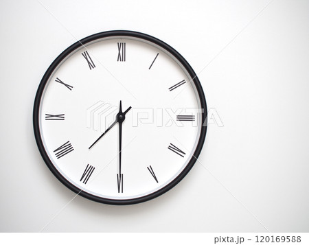 Clock Showing 19.30 or 07.30 with Roman Numerals. Simple Round Clock for Concepts of Time Management and Scheduling. Clock Showing 19.30 or 07.30 with Roman Numerals. Simple Round Clock for Concepts of Time Management and Scheduling. 120169588