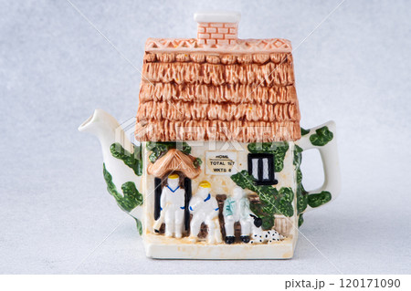 A kettle in the shape of a house. Antique porcelain tea pot. A kettle in the shape of a house. Antique porcelain tea pot. 120171090