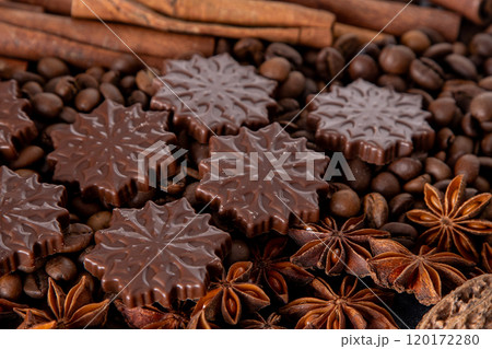 Food background. Coffee beans, cinnamon sticks, anise stars and chocolate candies. 120172280