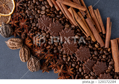 Food background. Coffee beans, cinnamon sticks, anise stars and chocolate candies. Food background. Coffee beans, cinnamon sticks, anise stars and chocolate candies. 120172284