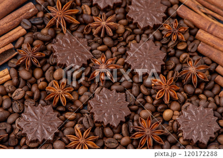 Food background. Coffee beans, cinnamon sticks, anise stars and chocolate candies. 120172288